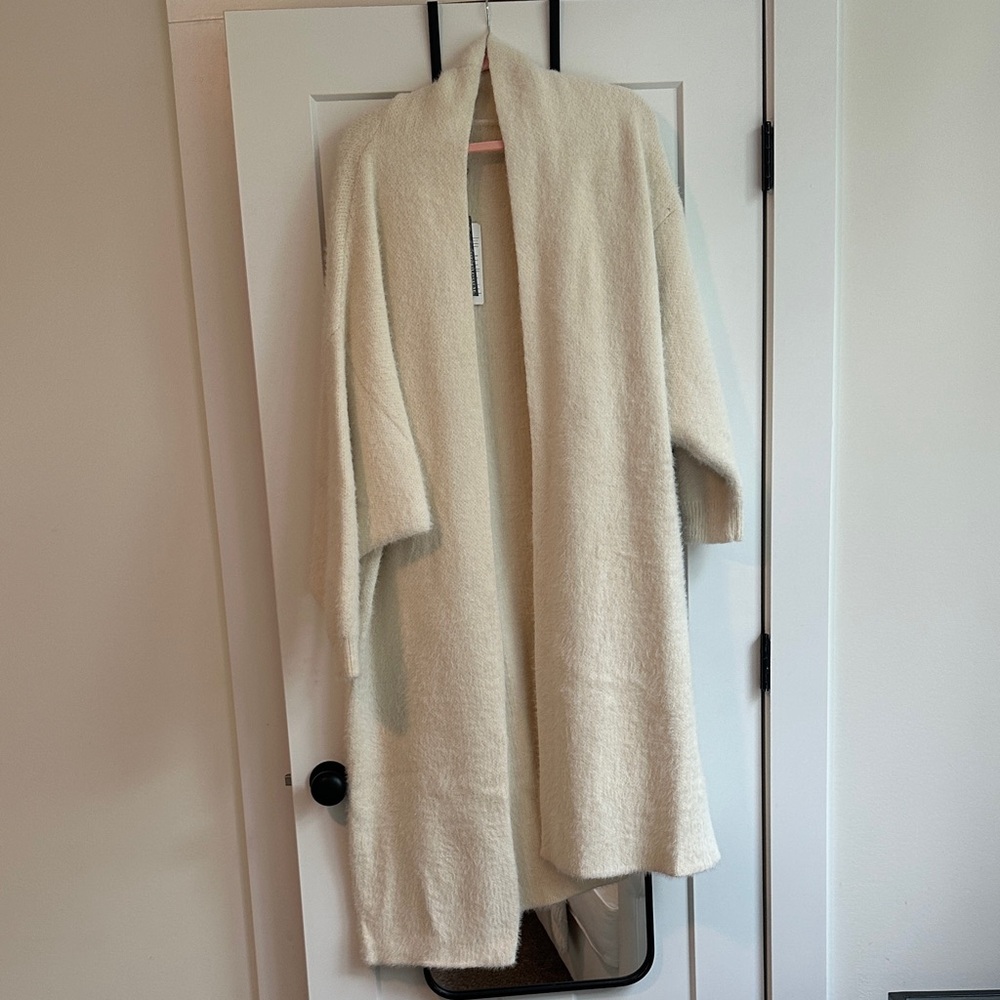 Seen on her oversized cardigan
